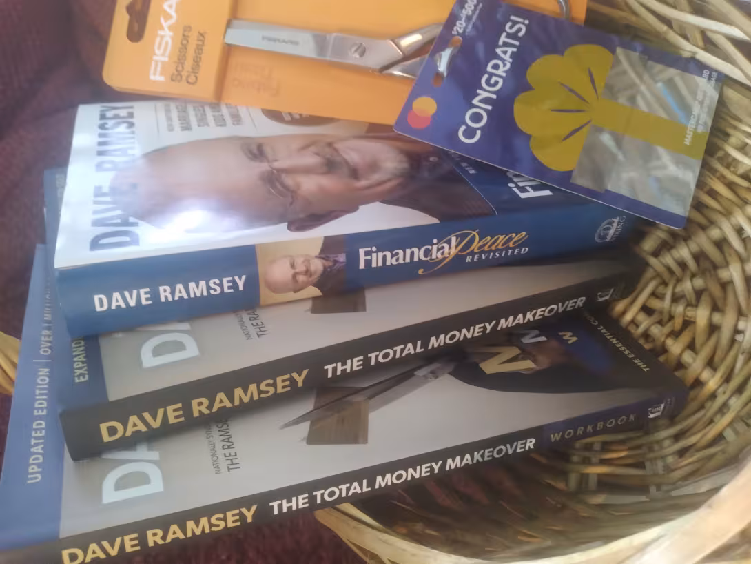 Basket of books, scissors, and gift card